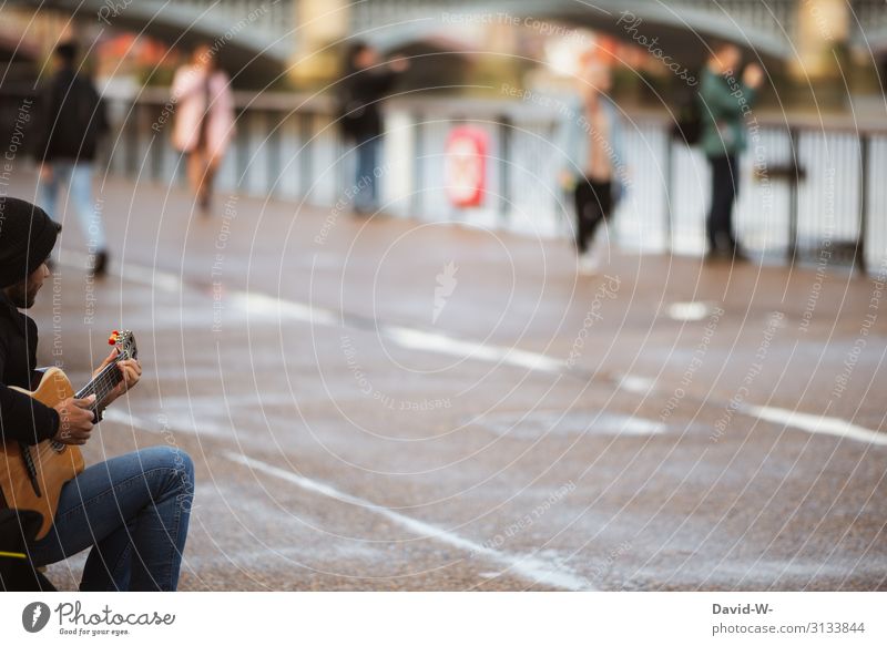 Street musician plays guitar Busker Musician Poverty corona Beg Sit Financial difficulty