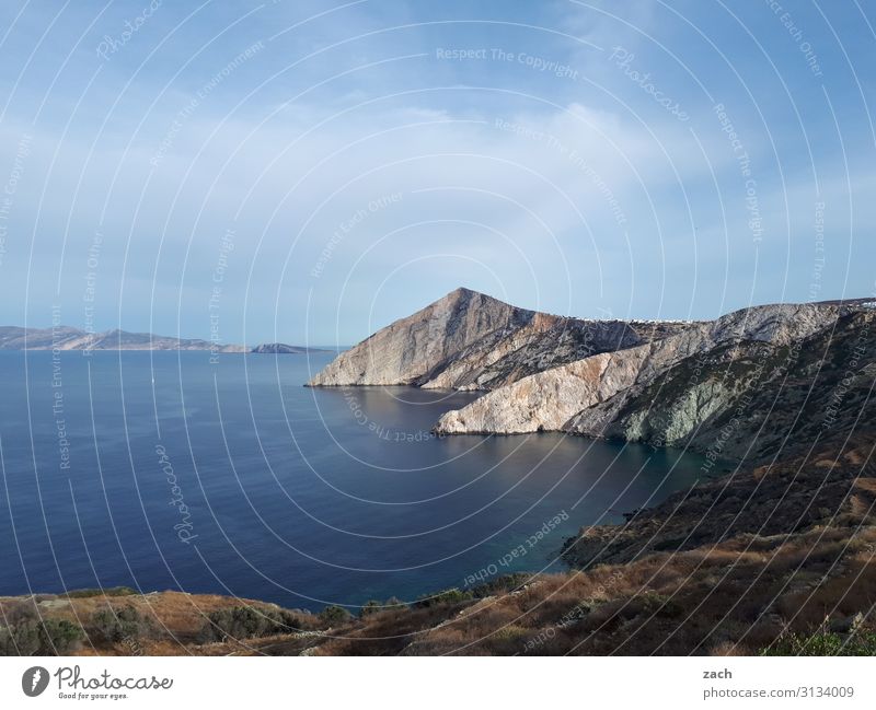 Just a rock in the sea Landscape Water Sky Clouds Beautiful weather Bushes Hill Rock Coast Ocean Mediterranean sea Aegean Sea Island Folegandros Cyclades Greece