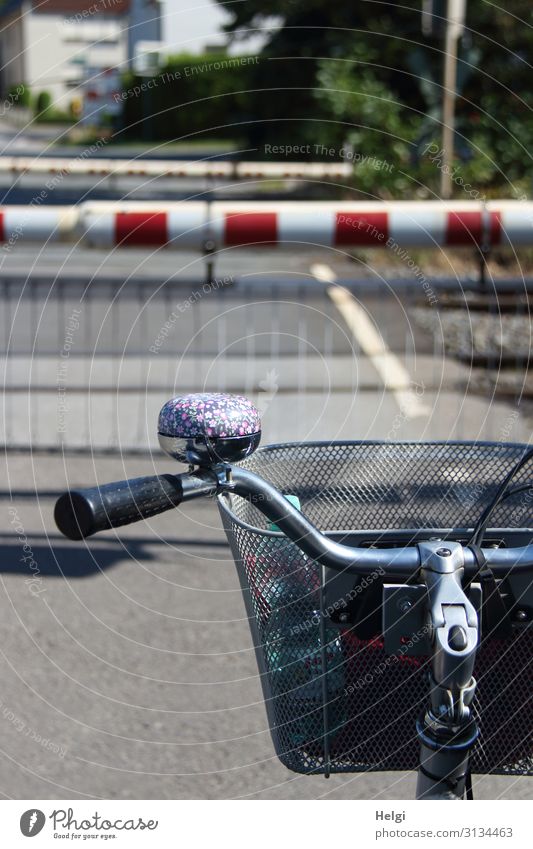 Detail of a bicycle, waiting in front of a closed train barrier Leisure and hobbies Trip Cycling tour Small Town Transport Traffic infrastructure Public transit