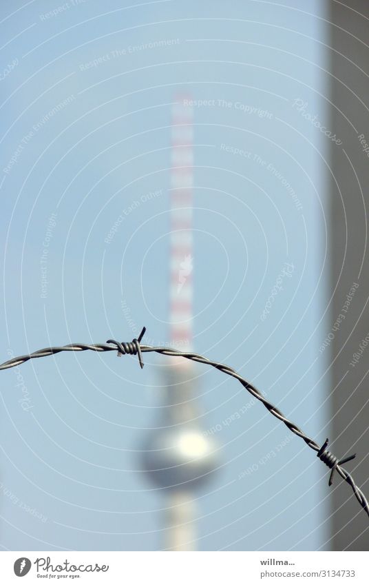 Berlin TV Tower behind Barbed Wire - Protection and Exclusion Barbed wire Wall (barrier) Border Politics and state travel ban Escape Copy Space