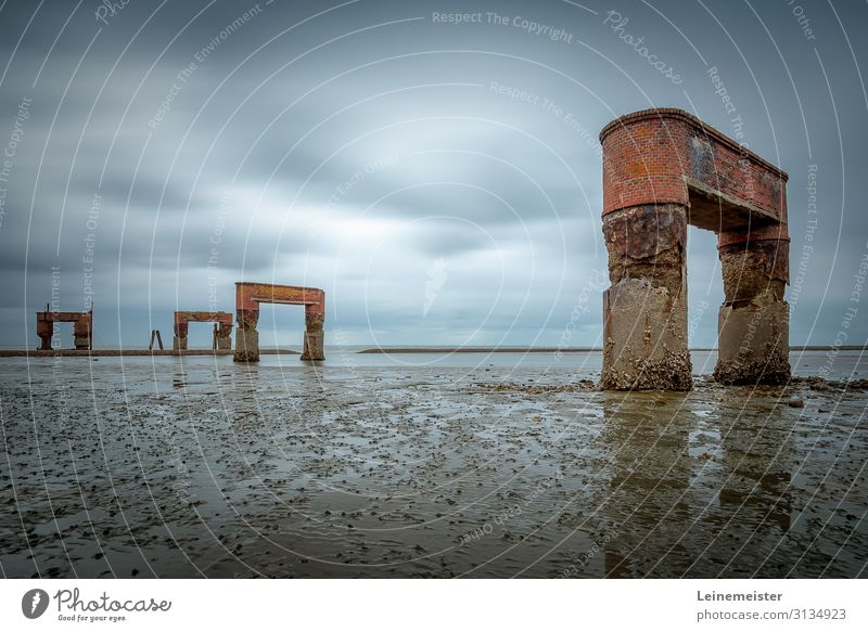 Remains of the jetty at Eckwarderhörne at the North Sea Butjadingen corner horns Landing stage Jadebusen watt Low tide Ruin remnants Brick Old Derelict