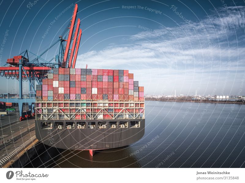 Container ship in the Port of Hamburg from behind Navigation Inland navigation Boating trip Gigantic Insurance Trade Economy Clouds Bridge Industry Business