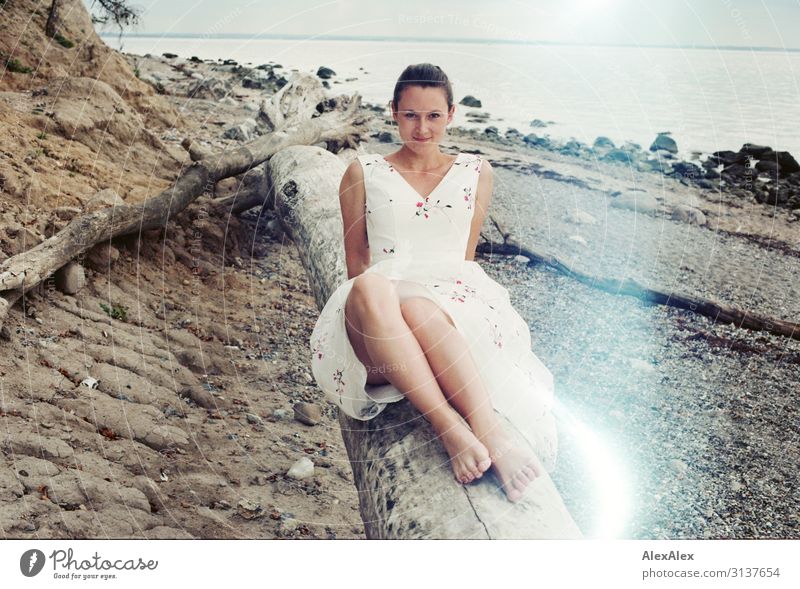 Young woman on the beach on analog picture with Lightleaks Elegant Style Joy Beautiful Life Summer Summer vacation Beach Tree trunk Ocean Coast