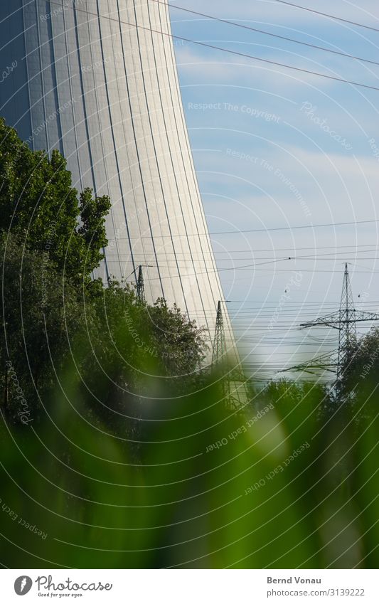 Riverland Energy industry Environment Hideous Electricity pylon Cooling tower Massive Tall Dominant Concrete Manmade structures Sky Sky blue Clouds Tree