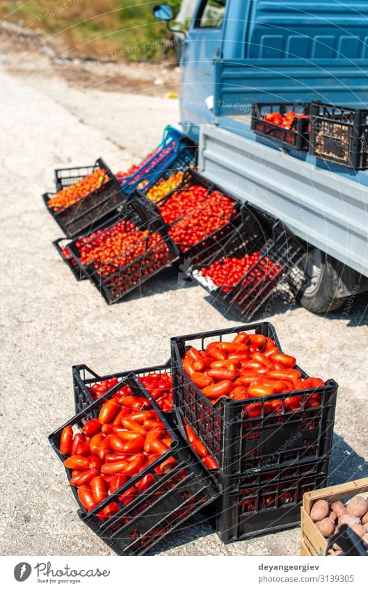 Small italian apo truck with tomatoes. Farmer sale tomatoes Food Vegetable Fruit Vegetarian diet Shopping Business Marketplace Street Stand Sell Fresh Natural