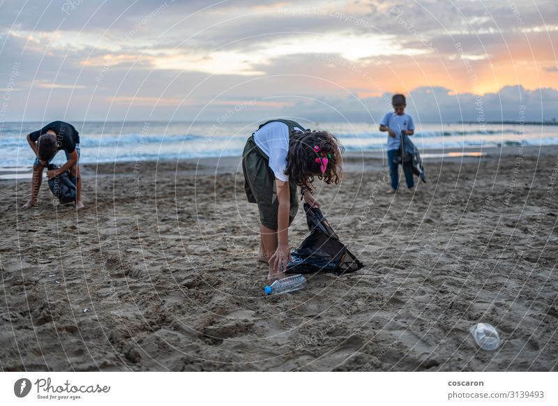 Group of children collecting plastic on a beach Bottle Happy Vacation & Travel Summer Beach Ocean Child Schoolchild Educational trip Human being Toddler