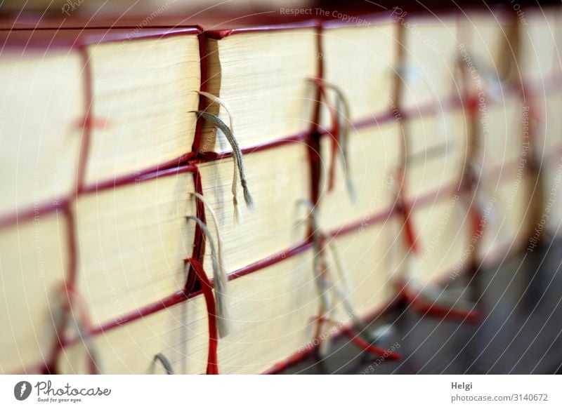 Close-up of many stacked songbooks with marking tapes in a church Church Dome Line String Lie Authentic Exceptional Uniqueness Gray Red White Moody Peace