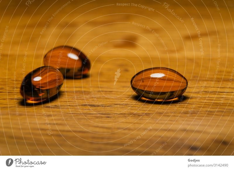 Capsules with black cumin oil on a wooden plate| Weltschmerz Wood Pill Black cumin Healthy Contentment weltschmerz Allergy Illness Nutrional supplement