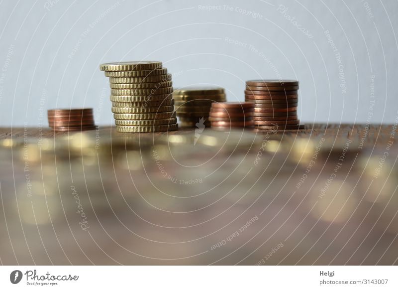 Small change is stacked on a table Coin Metal Money Lie Exceptional Brown Gold Gray Uniqueness Arrangement Thrifty Stack Save Collection Colour photo