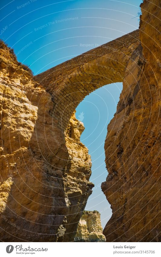 Lagos Bridge Nature Cloudless sky Sunlight Summer Beautiful weather Rock Portugal Europe Gate Manmade structures Breathe Observe Think Relaxation To enjoy