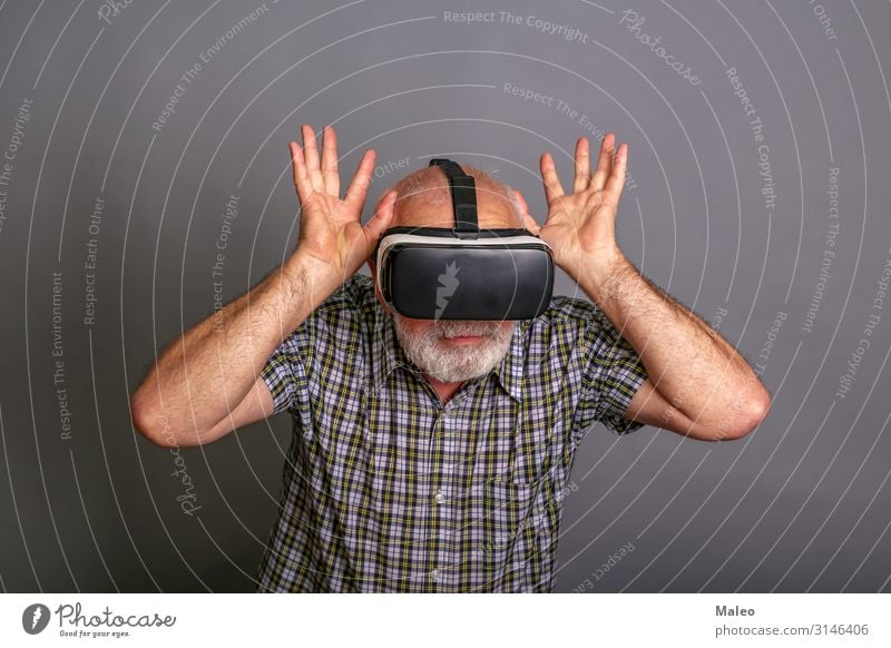 Man wearing virtual reality glasses. Studio recording, grey background Really Virtual VR Eyeglasses Panorama (Format) Playing Technology gadget Digital