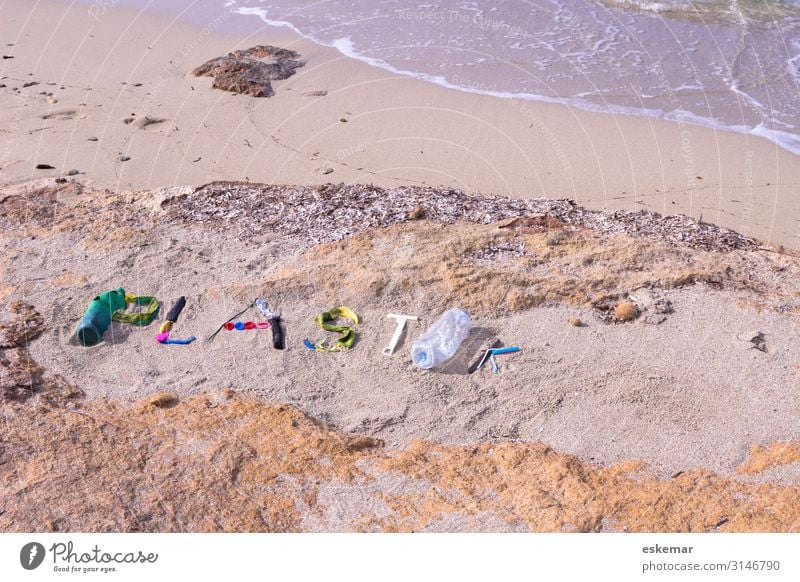 Plastic garbage on the beach Beach Ocean Environment Nature Sand Water Coast Packaging Plastic packaging Trash Plastic waste Sign Characters Word writing Lie