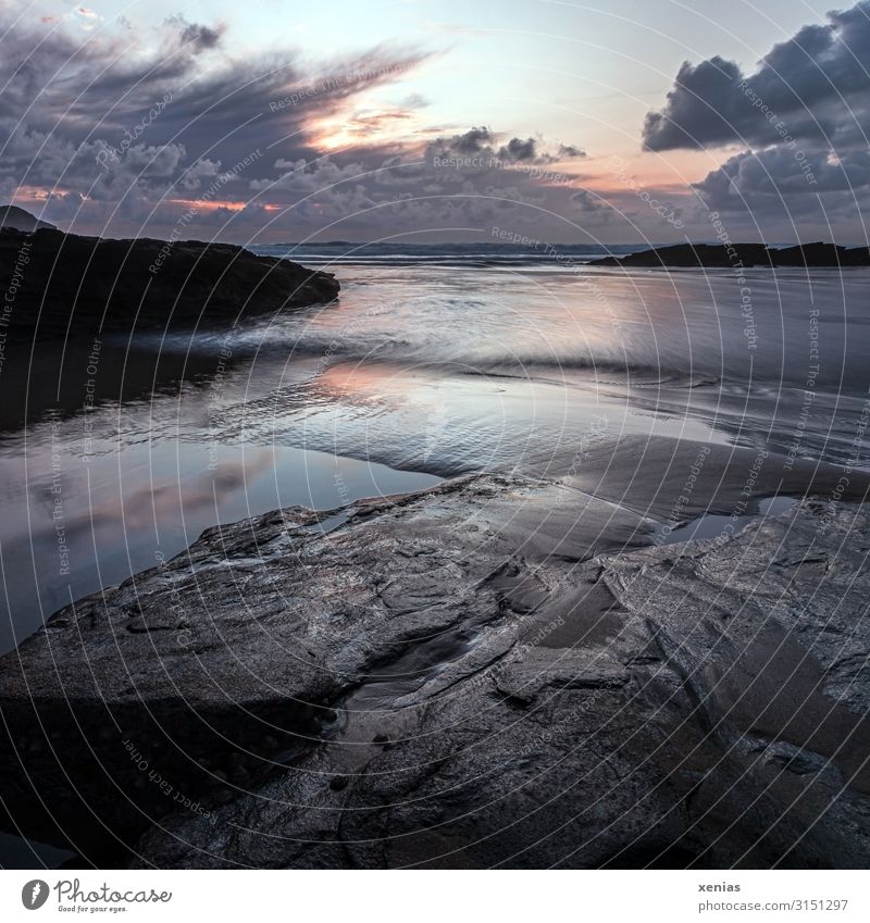 Trebarwith beach in Cornwall at sunset with clouds, rocks and incoming tide Beach Sunset Vacation & Travel coast Tourism Ocean Waves Twilight Environment Nature