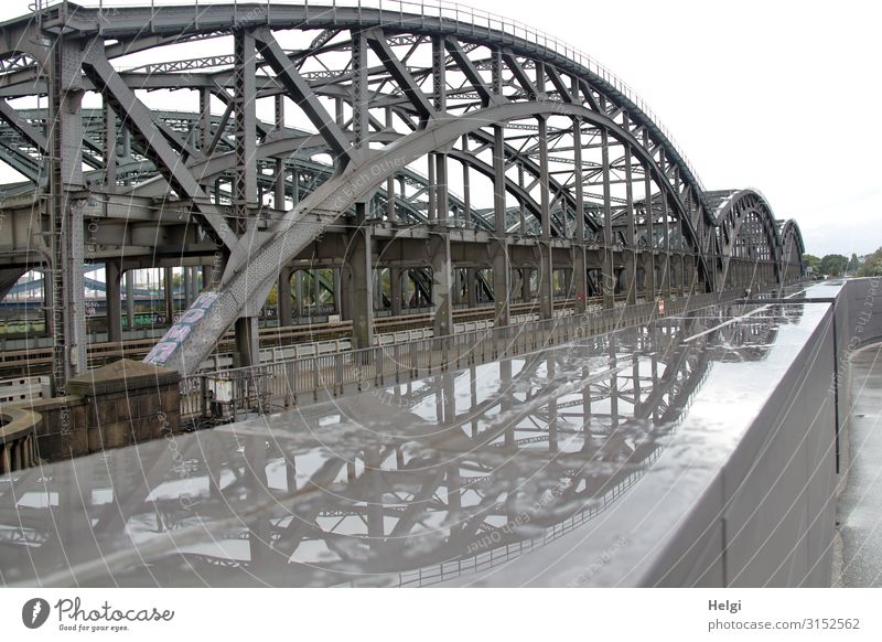 Metal construction of the Elbe bridges in Hamburg with reflection in a puddle Bridge Manmade structures Architecture Traffic infrastructure Passenger traffic