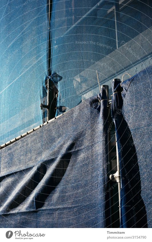 Building site in shades of blue Construction site Blue cordon Scaffolding Metal safety net Plastic Safety Grating Structures and shapes Light Shadow Hoarding