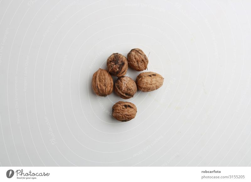 Garlic walnuts in color background Nutrition Vegetarian diet Diet Table Group Nature Wood Natural Brown Open vintage healthy Shell Nutshell food Vegan diet Raw