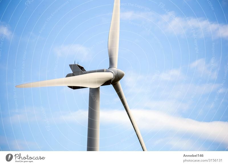 modern windmill on a sunny day and with idyllic white clouds Industry Technology Wind energy plant Environment Nature Landscape Plant Sky Clouds Grass Modern