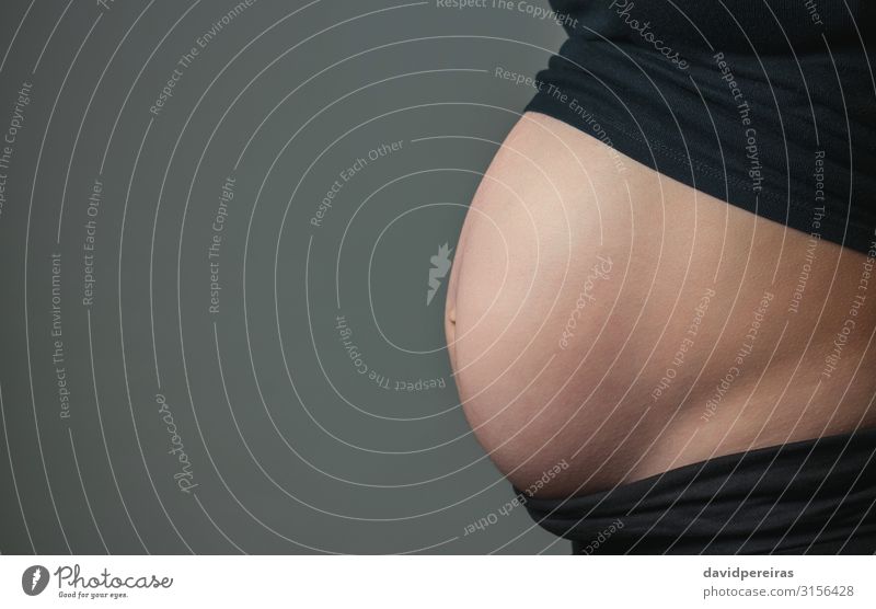 Belly of pregnant woman in profile Lifestyle Beautiful Health care Human being Woman Adults Parents Mother Naked Pregnant Anticipation belly uncovered