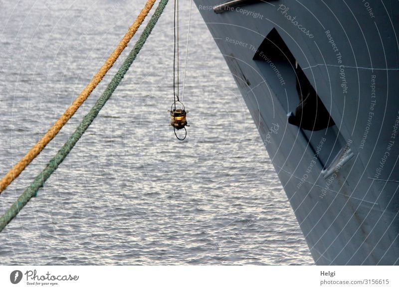 small lamp hanging on the bow of a big ship, which is tied up with ropes Environment Water River Elbe Navigation Watercraft Harbour Anchor Rope Lamp To hold on