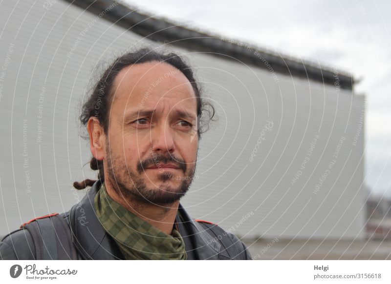 Portrait of a thoughtful looking man with dark hair and beard Human being Masculine Man Adults Head Hair and hairstyles Face 1 45 - 60 years Wall (barrier)