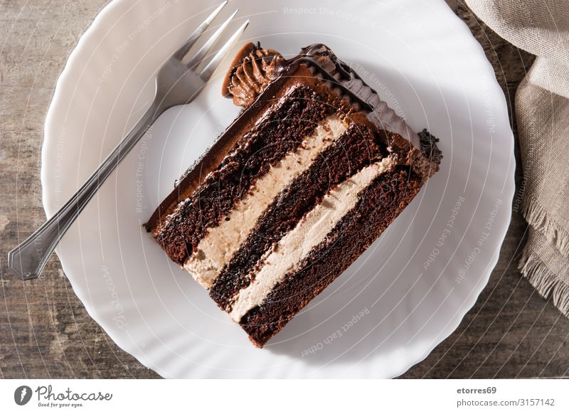 Chocolate cake slice on wooden table Baked goods Cake Slice Sweet Dessert Pie Food Food photograph Home-made Cream tart Pudding Baking Tasty walnut Snack recipe