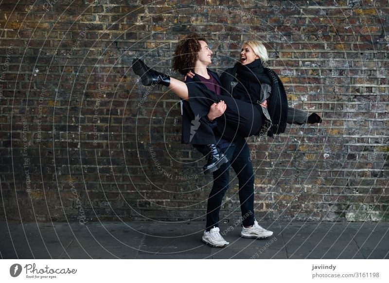 Man holding his girlfriend in his arms Joy Happy Hair and hairstyles Human being Masculine Feminine Young woman Youth (Young adults) Young man Woman Adults