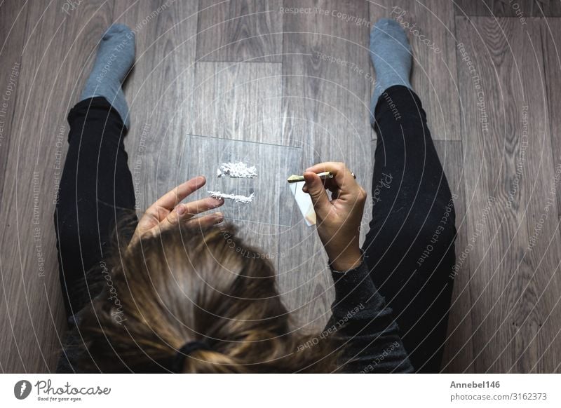 Young woman snorting drugs, cocaine or speed or other drugs Money Table Woman Adults Youth (Young adults) Hand Line Sadness Black White Loneliness addiction