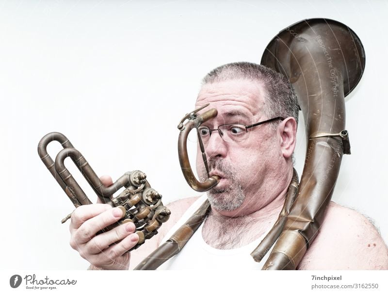 An astonished man plays a broken brass instrument Human being Masculine Man Adults Body Head Hair and hairstyles Face Eyes Ear Nose Mouth Lips Facial hair Chest