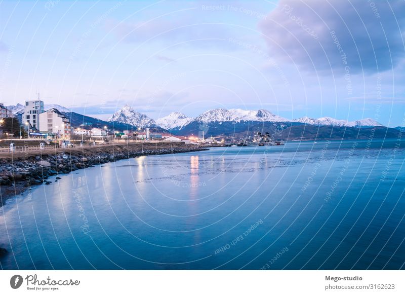 A view of Ushuaia and mountains in winter. Beautiful Vacation & Travel Tourism Ocean Winter Snow Mountain Nature Landscape Sky Clouds Park Forest Coast Lake