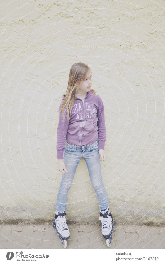 skater Child Girl Infancy Roller skates Inline skates Inline skating Stand Wall (building) Exterior shot Playing Portrait photograph High-key Pastel tone