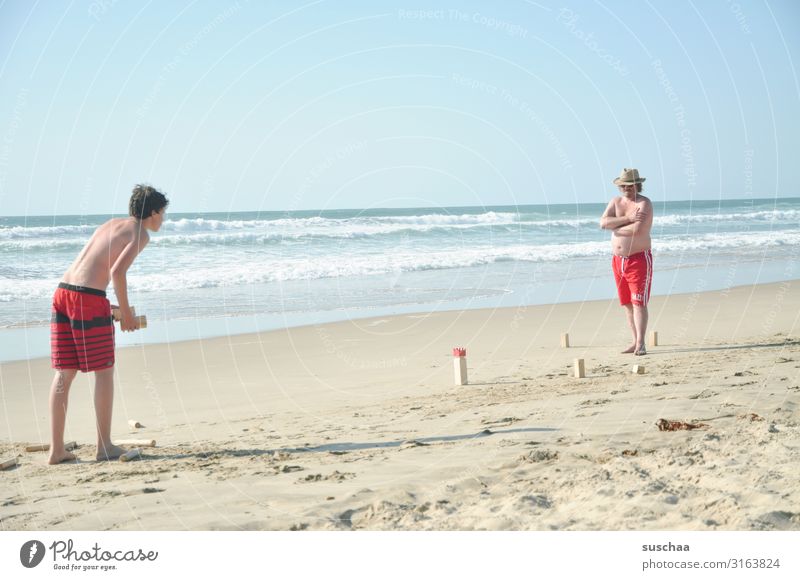 vacationers on the beach Man Summer Swimming trunks Ocean Atlantic Ocean Sandy beach wide holidays Holidaymakers Summer vacation Waves Vacation & Travel Beach