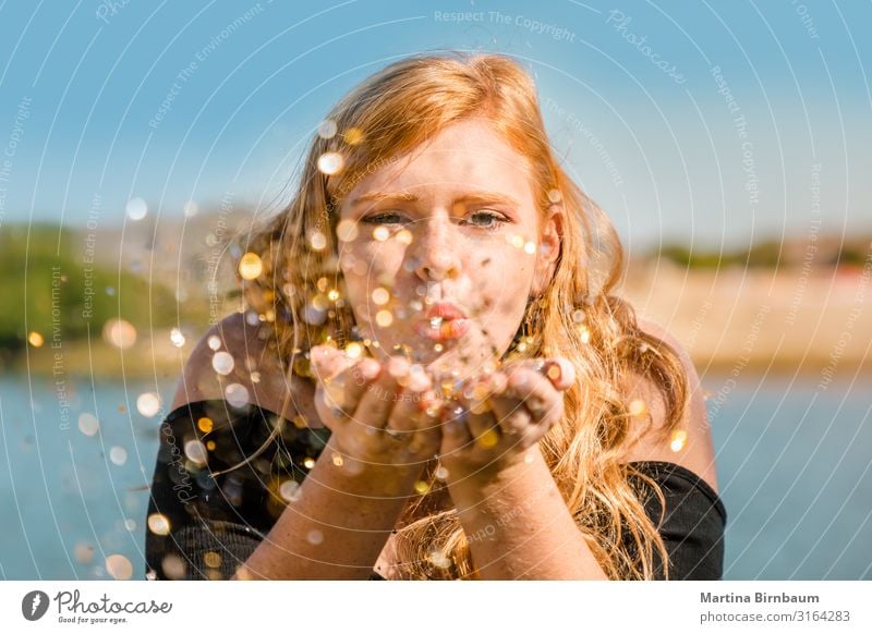 Beautiful teenager with redhair and freckles blowing confettis Lifestyle Joy Happy Face Make-up Summer Feasts & Celebrations Human being Young woman