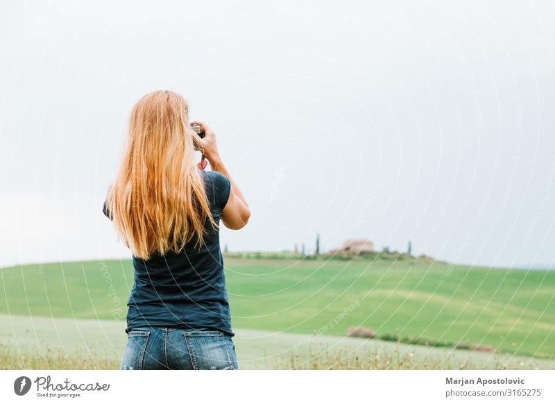 Young woman taking a photo of landscape in Tuscany Leisure and hobbies Photography Vacation & Travel Tourism Sightseeing Camera Feminine Youth (Young adults)