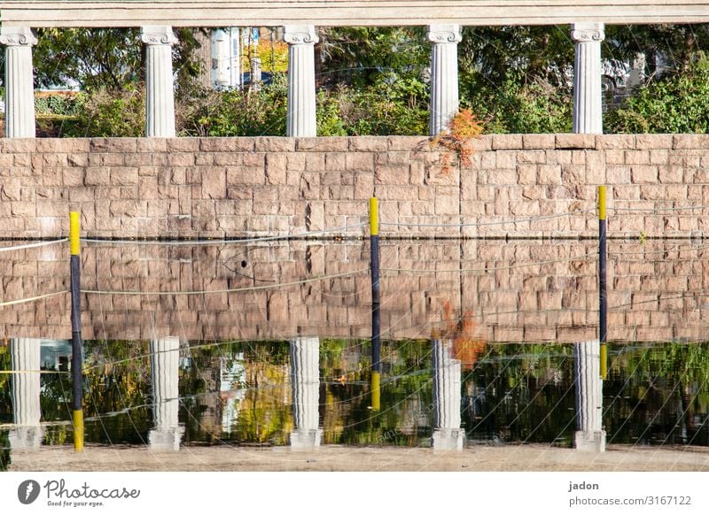 window. Art Work of art Water Beautiful weather Bushes Park Manmade structures Wall (barrier) Wall (building) Ornament Stand Unwavering Arrangement Column