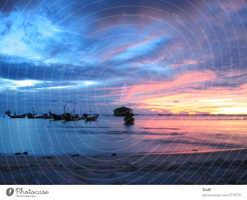 Sunrise at the beach Beach Ocean Clouds Watercraft Night Sand