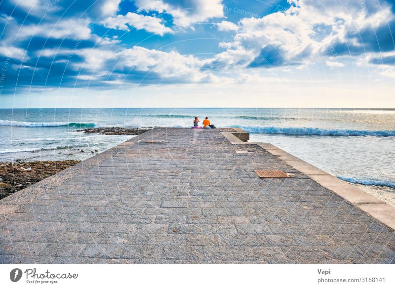 Couple people sitting on stone pier Lifestyle Joy Happy Beautiful Leisure and hobbies Vacation & Travel Tourism Trip Adventure Far-off places Freedom Summer