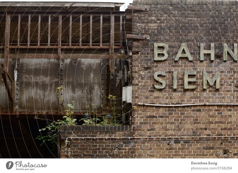 Old S-Bahn station in Berlin Siemensstadt Capital city Train station Wall (barrier) Wall (building) Commuter train station Bridge Commuter trains Characters