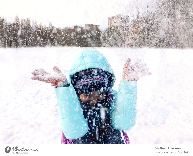 Teenager girl in winter outdoor fun and throwing snow Joy Happy Playing Vacation & Travel Winter Snow Child Infancy Nature Happiness Cute White girl winter