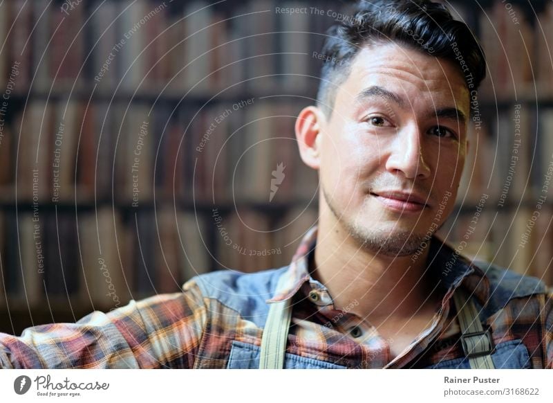 Portrait in front of book wall Masculine Man Adults Face 1 Human being 30 - 45 years Book Library Shirt Suspenders Black-haired Cool (slang) Friendliness