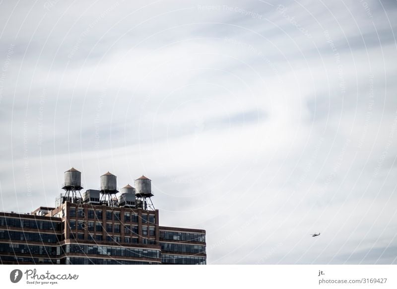 New York Water Tanks Water tank New York City Manhattan Town Capital city Skyline Architecture Helicopter Flying Vacation & Travel Clouds Colour photo