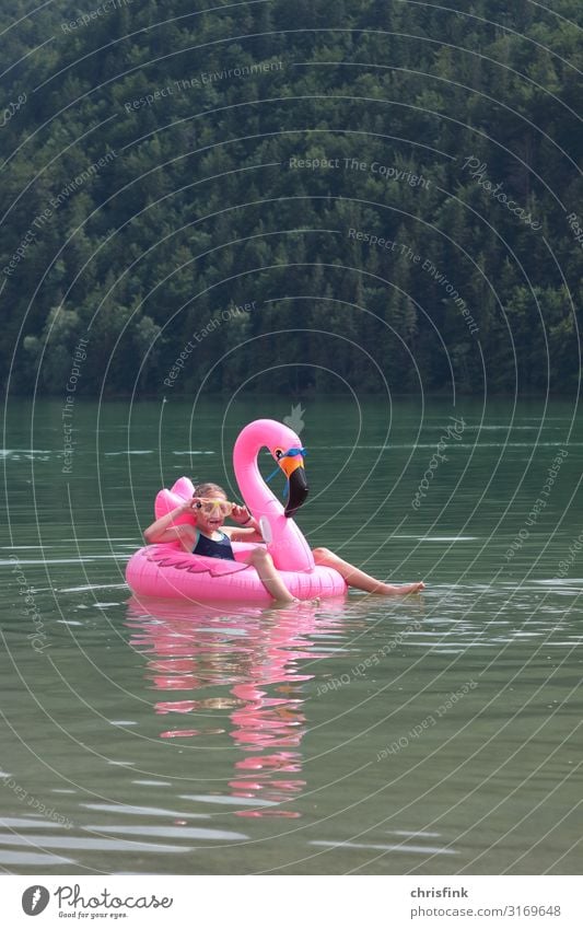 Child at sea with swimming animal Vacation & Travel Tourism Summer vacation Waves Sports Swimming & Bathing Human being Girl 1 8 - 13 years Infancy Water Animal