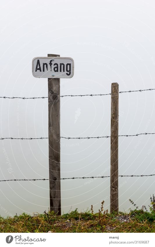 beginning of week Fog Barbed wire fence Signs and labeling Beginning Wooden stake Signage Warning sign Creepy Warning label Threat Exclusion Colour photo