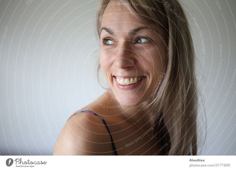 Side portrait of smiling woman with long blond hair Style Joy pretty Life Contentment Woman Adults Face 30 - 45 years Blonde Long-haired Freckles Shoulder