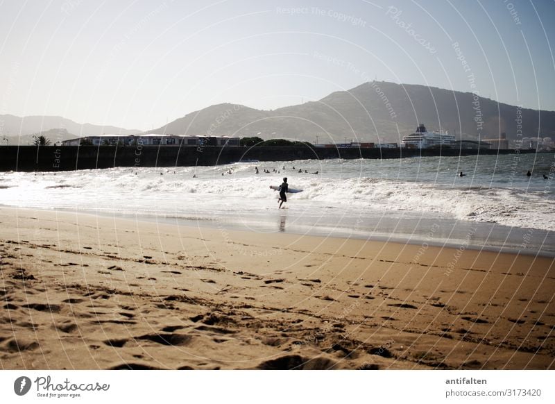 Young surfer at the beach of Getxo/Bilbao Spain Beach Surfer Ocean Waves Coast Aquatics Exterior shot Colour photo Vacation & Travel Sports Summer Sand Water