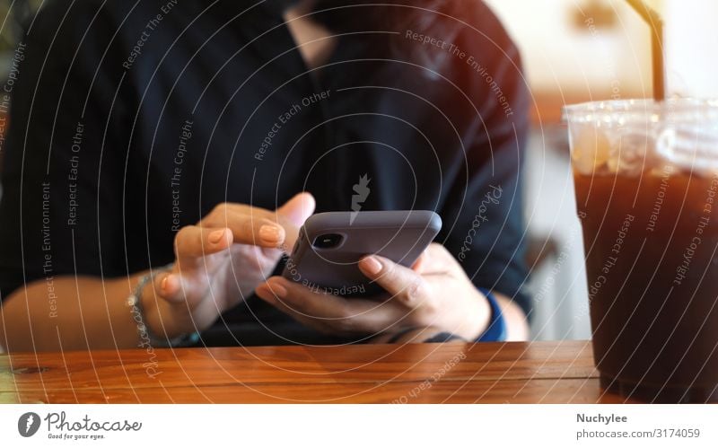 Young customer woman using smartphone while drinking iced coffee Coffee Lifestyle Style Beautiful Relaxation Summer Table Restaurant Work and employment