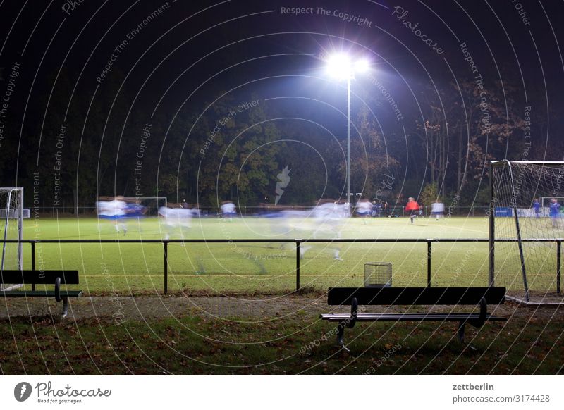 Football in the evening Evening Dark Floodlight Soccer League Region Playing Sports subclass regional league Ball sports mass sports popular sport Motion blur