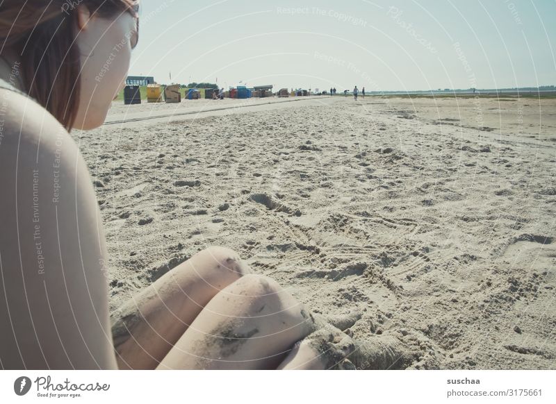 teenager sitting on a beach in the sand of the wadden sea Tourism Relaxation Exterior shot Far-off places Coast Mud flats Vacation & Travel Horizon Water Tide