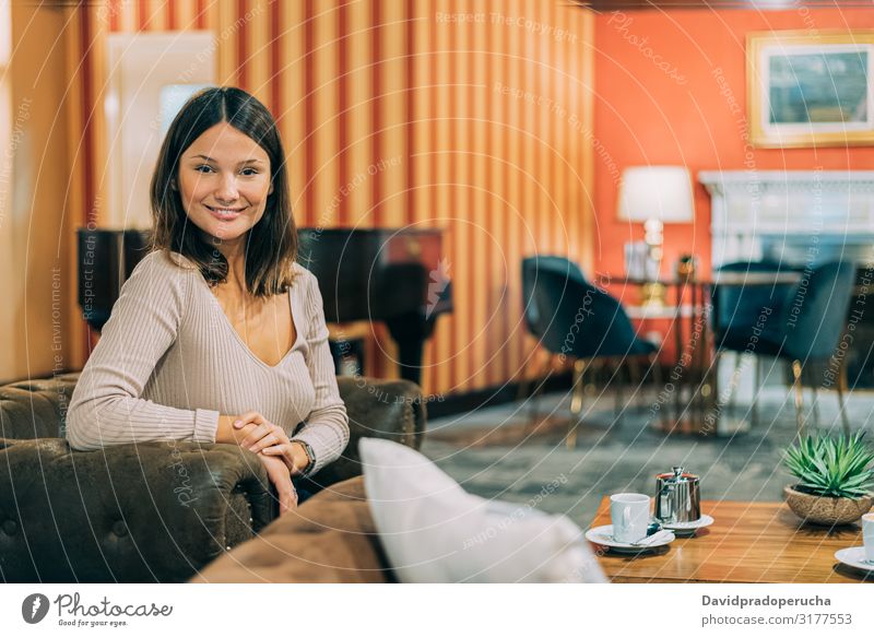 portrait of a young attractive woman in a elegant hotel cafeteria lifestyle copy space restaurant beautiful indoor interior smile lobby luxury hall pretty one