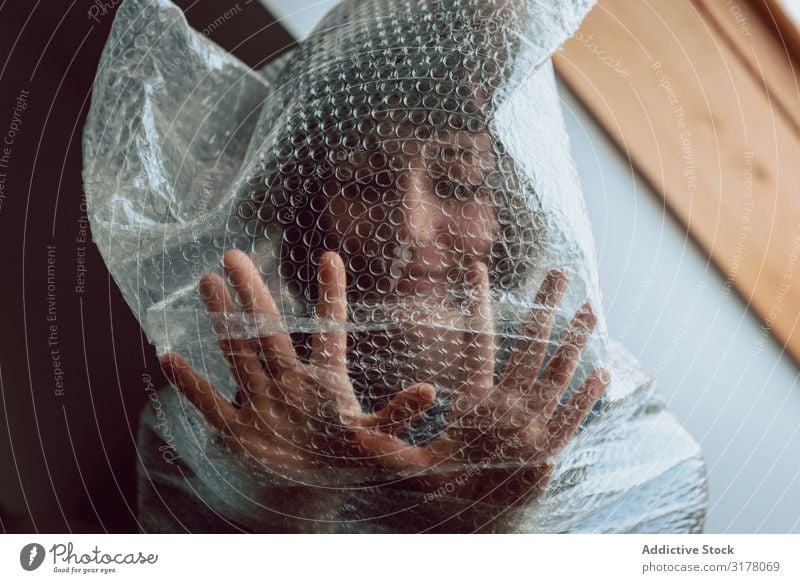 Woman entangled in bubble wrap Plastic Reduce resources Bubble wrap Destruction Trash pollute Trash container Sustainability disposal Conceptual design