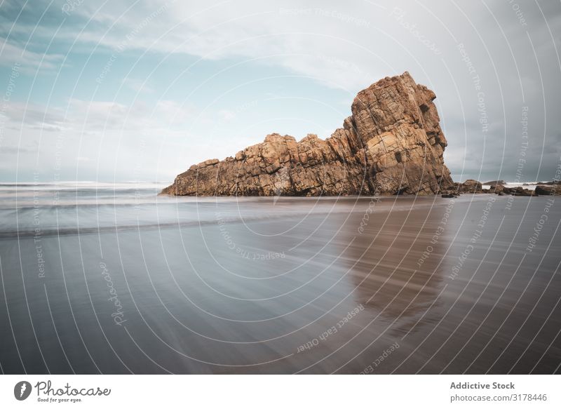 Coastal rock on beach and overcast sky Rock Beach Sky coastal Cloud cover Long exposure Gloomy Cliff Picturesque Spain asturias Vantage point Dramatic Beautiful